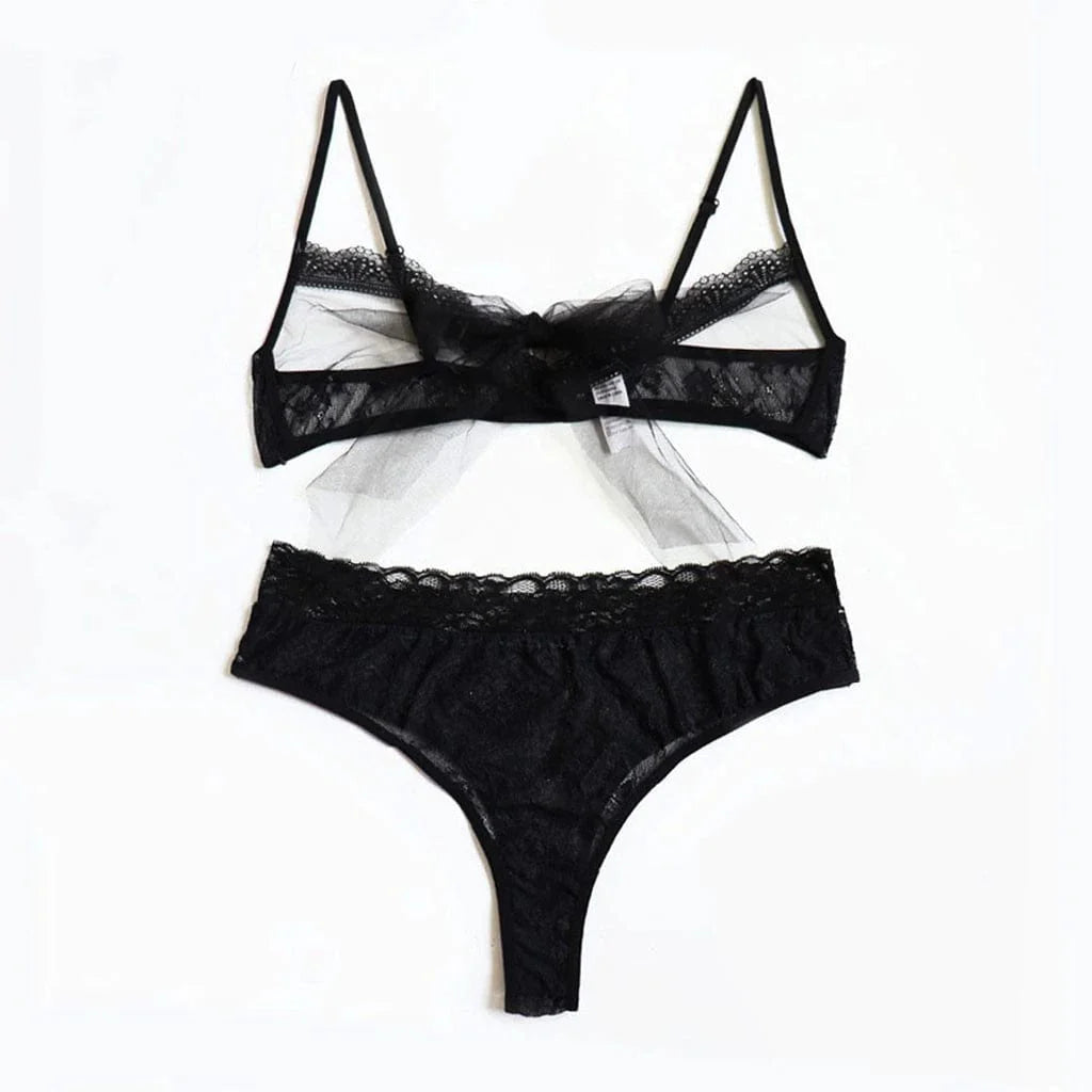 Showlu Fashion women's sexy lace hollow-out cut-out tight underwear set, featuring intricate lace details and a form-fitting design.