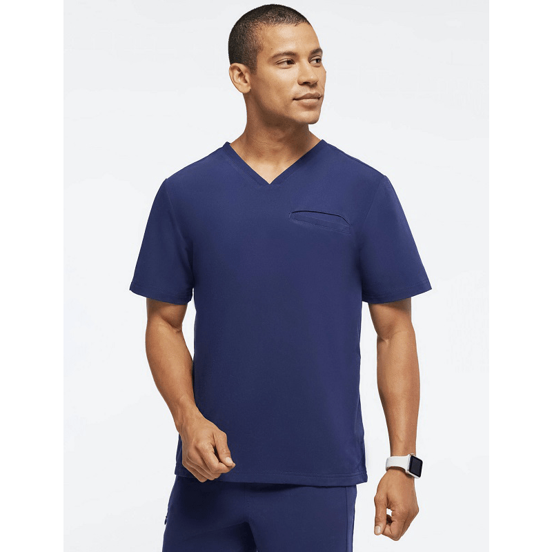 Unisex medical scrub set with short sleeves, stretchy jogger pants, suitable for men and women, in a beauty salon or medical setting.