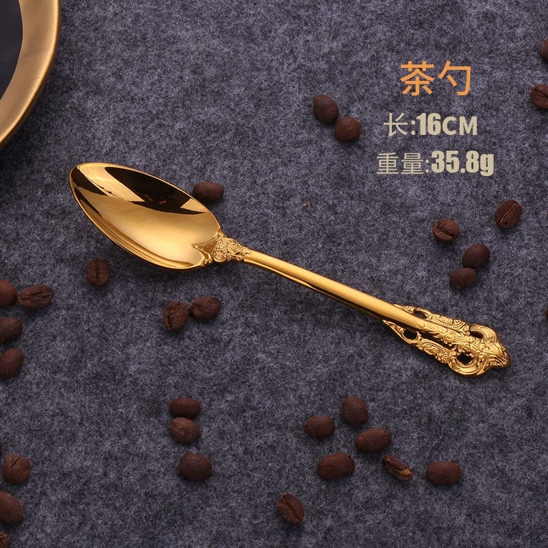 Nordic Relief Golden stainless steel Western tableware set with knife, fork, and spoon, featuring a sleek design and golden finish.