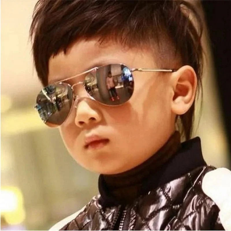 Kids pilot sunglasses with metal frame and mirror lenses, stylish goggles for boys and girls from Showlu Fashion Store.