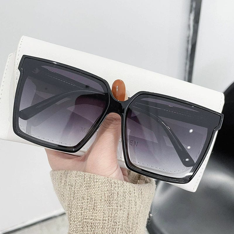 Showlu Fashion women's oversized trendy sunglasses with UV protection, stylish design for summer sun protection and fashionable look.