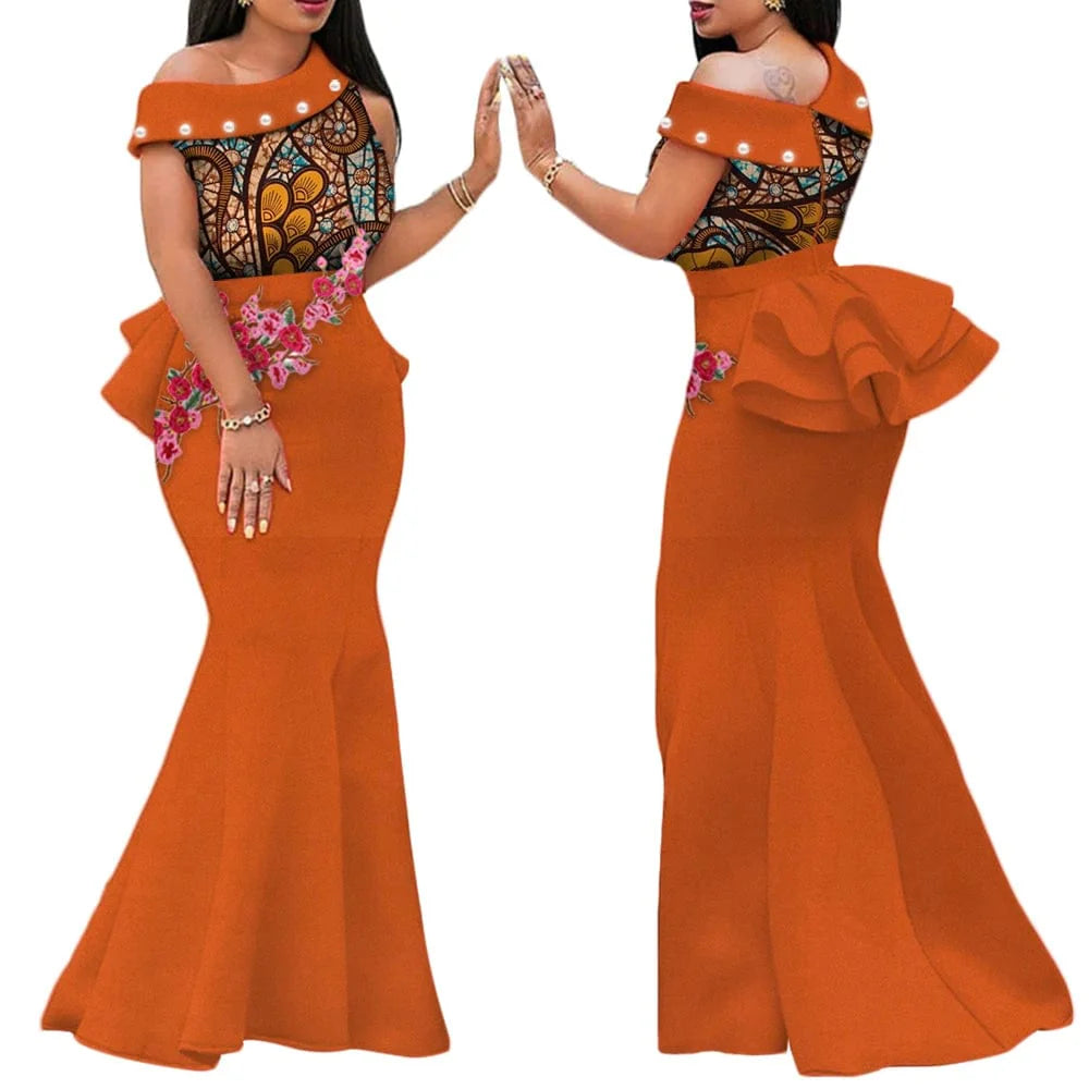 African print long dress by SHOWLU FASHION with cotton applique, draped design, and vibrant traditional motifs for women.