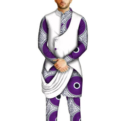 A man wears a traditional African two-piece set featuring a purple and white circular print.