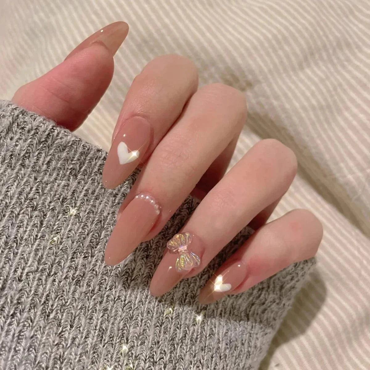 Set of 24 mid-length coffin press-on acrylic nails with full cover tips, in a natural nude color for stylish false nail art.