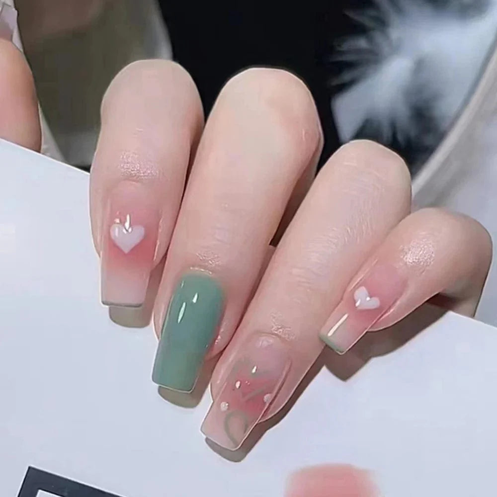 Set of 24 Showlu Fashion Store mid-length coffin press-on acrylic false nails with full cover design and natural nail tips.