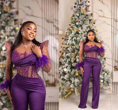 A purple long-sleeve jumpsuit with a beaded illusion bodice and feather-trimmed cuffs.
