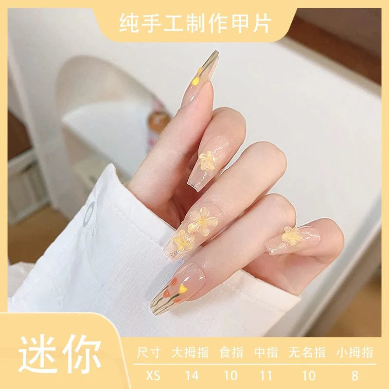 Xiaonan Classmate Aurora Camellia press-on nails by Showlu Fashion Store featuring a gentle blush design with elegant, long nail style.