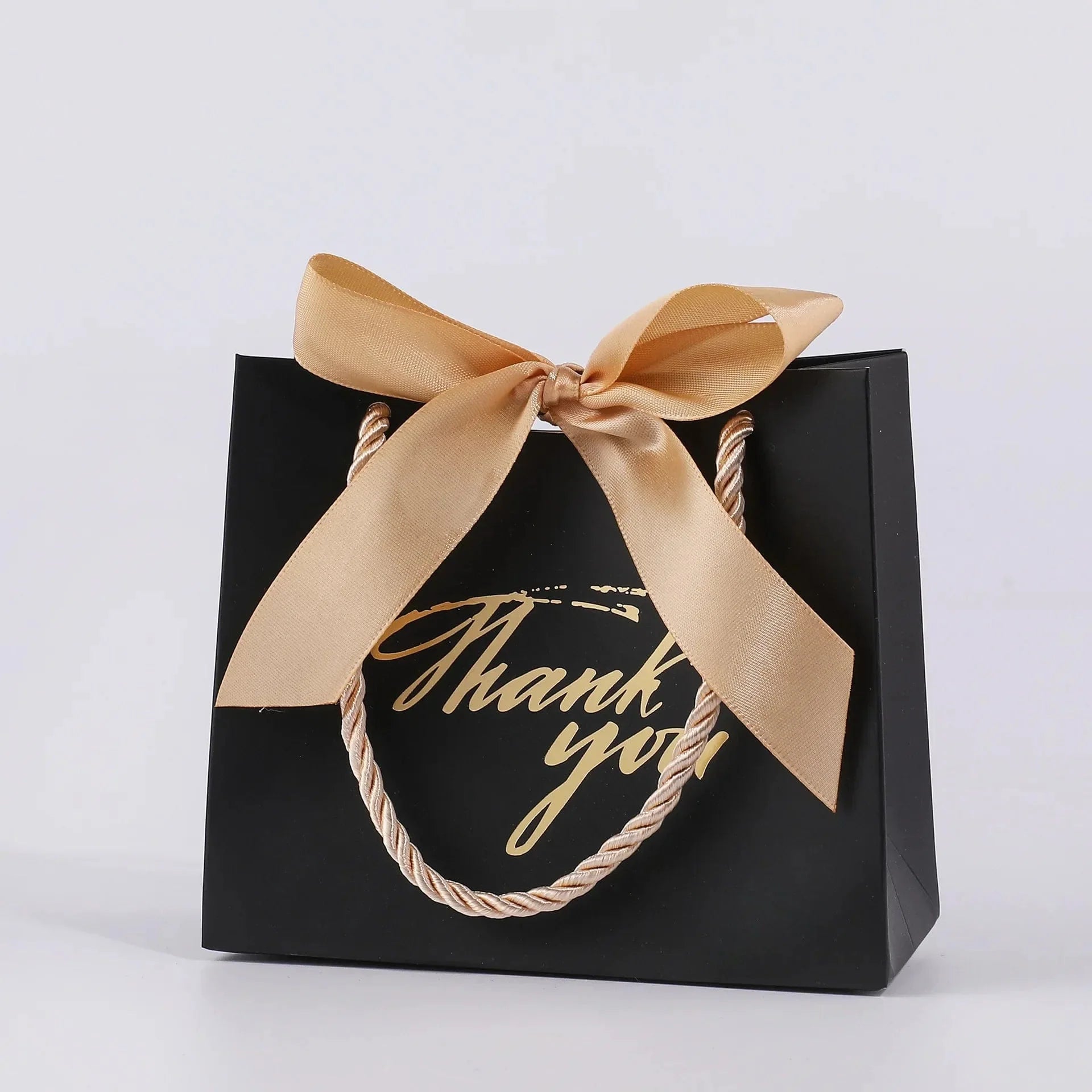 Set of 50 small black paper gift bags with handles from Showlu Fashion Store, perfect for occasions, measuring 5.5x2.5x4.7 inches.