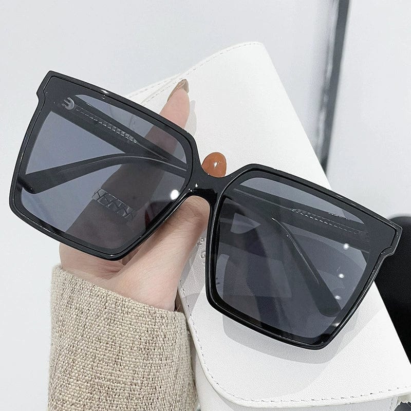 Showlu Fashion women's oversized black and gray UV protection sunglasses with a trendy design, perfect for summer sun protection.
