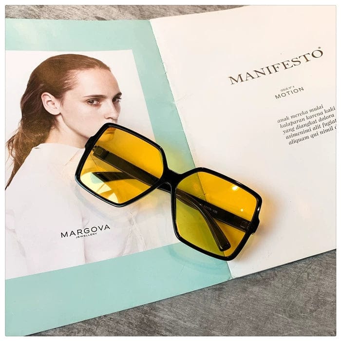 Showlu Women's Oversized Square Polarized Sunglasses with black frame, yellow accent, UV protection, trendy style for women.