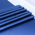 Elegant blue satin table runner by Showlu Fashion, 12x108 inches, smooth polyester fabric for wedding and party decor.