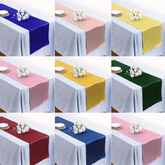 A grid of nine satin table runners in various colors, each draped over a white tablecloth with a floral centerpiece.