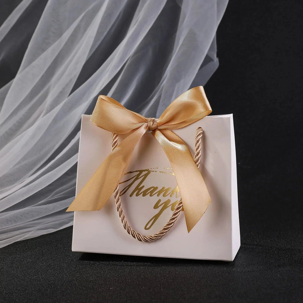 Small paper gift bags with handles by Showlu Fashion, perfect for thank you favors, in a set of 20 or 50.