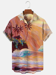 A short-sleeved Hawaiian shirt featuring a vibrant, artistic print of a tropical beach at sunset.