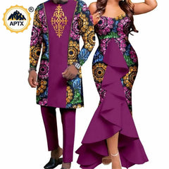 A man and woman wearing matching purple outfits with floral patterns and solid fabric accents.