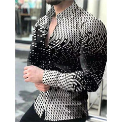 A man wears a long-sleeved button-down shirt featuring a black and white oval dot pattern.