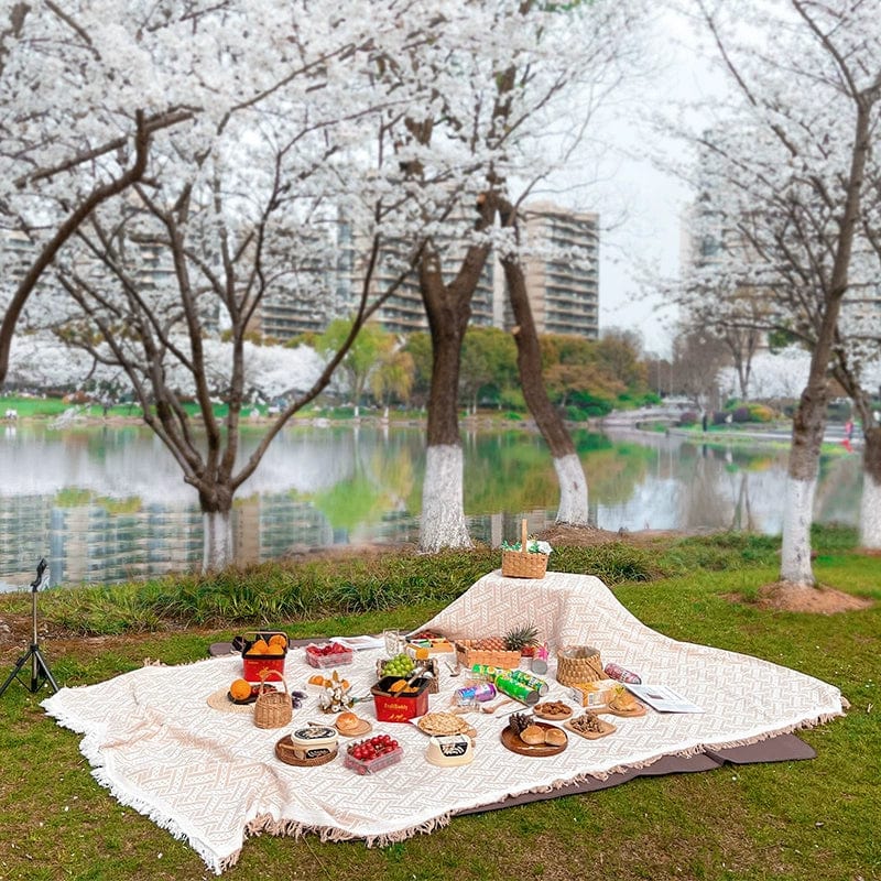 Red geometric picnic blanket by M.J.HONG, moisture-proof lawn mat ideal for spring outings and outdoor picnics.
