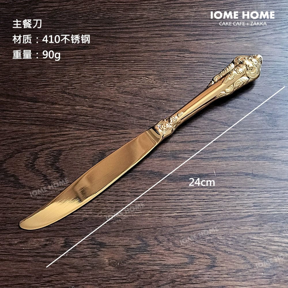 Showlu French Retro Relief stainless steel main meal and dessert spoon and fork set with gold finish and hollow handles.