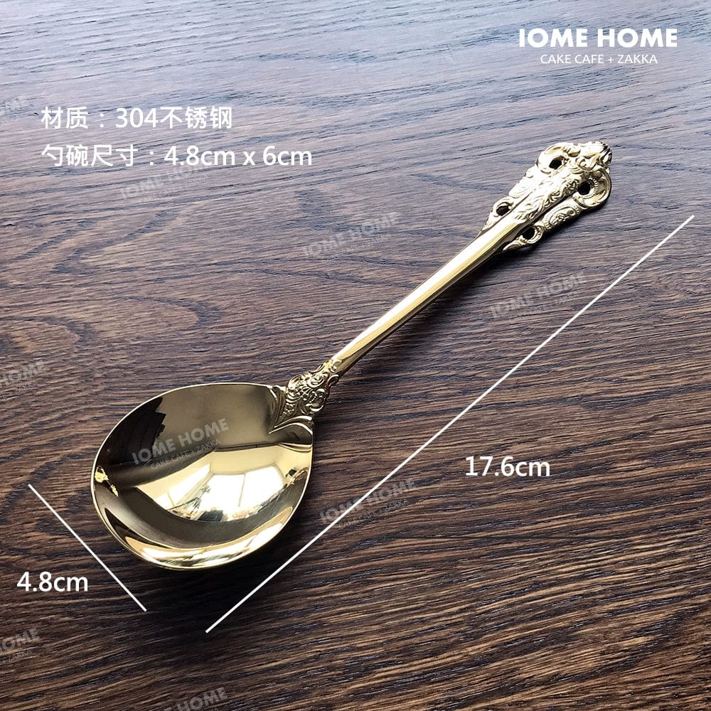 Showlu French retro relief stainless steel main meal and dessert spoon and fork set, gold-colored with intricate design details.