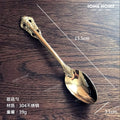 Gold stainless steel Showlu French Retro Relief dessert spoon and fork set, featuring intricate design for main meals and desserts.