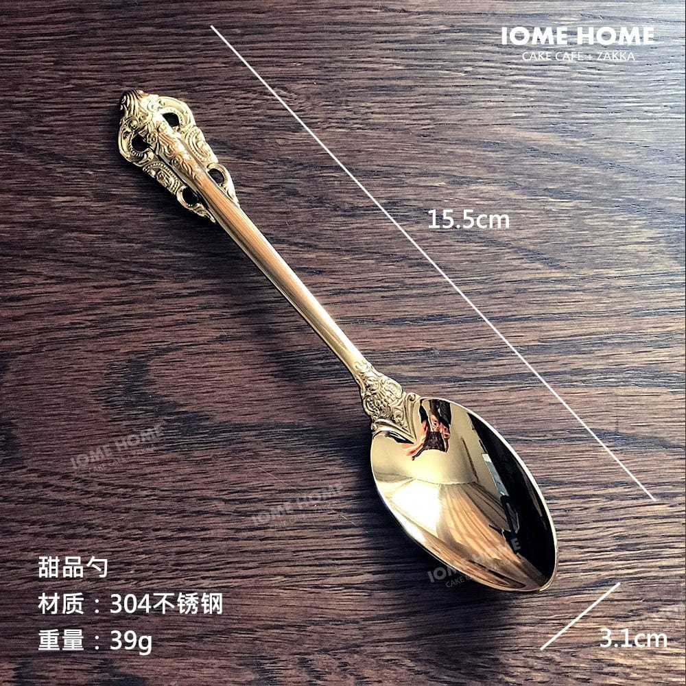 Gold stainless steel Showlu French Retro Relief dessert spoon and fork set, featuring intricate design for main meals and desserts.