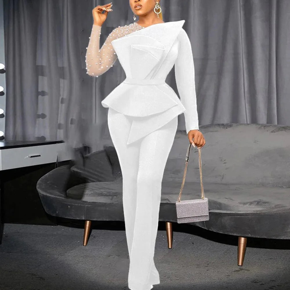 Elegant women's beaded high-waisted party jumpsuit with round neck and transparent sleeves by SHOWLU FASHION.