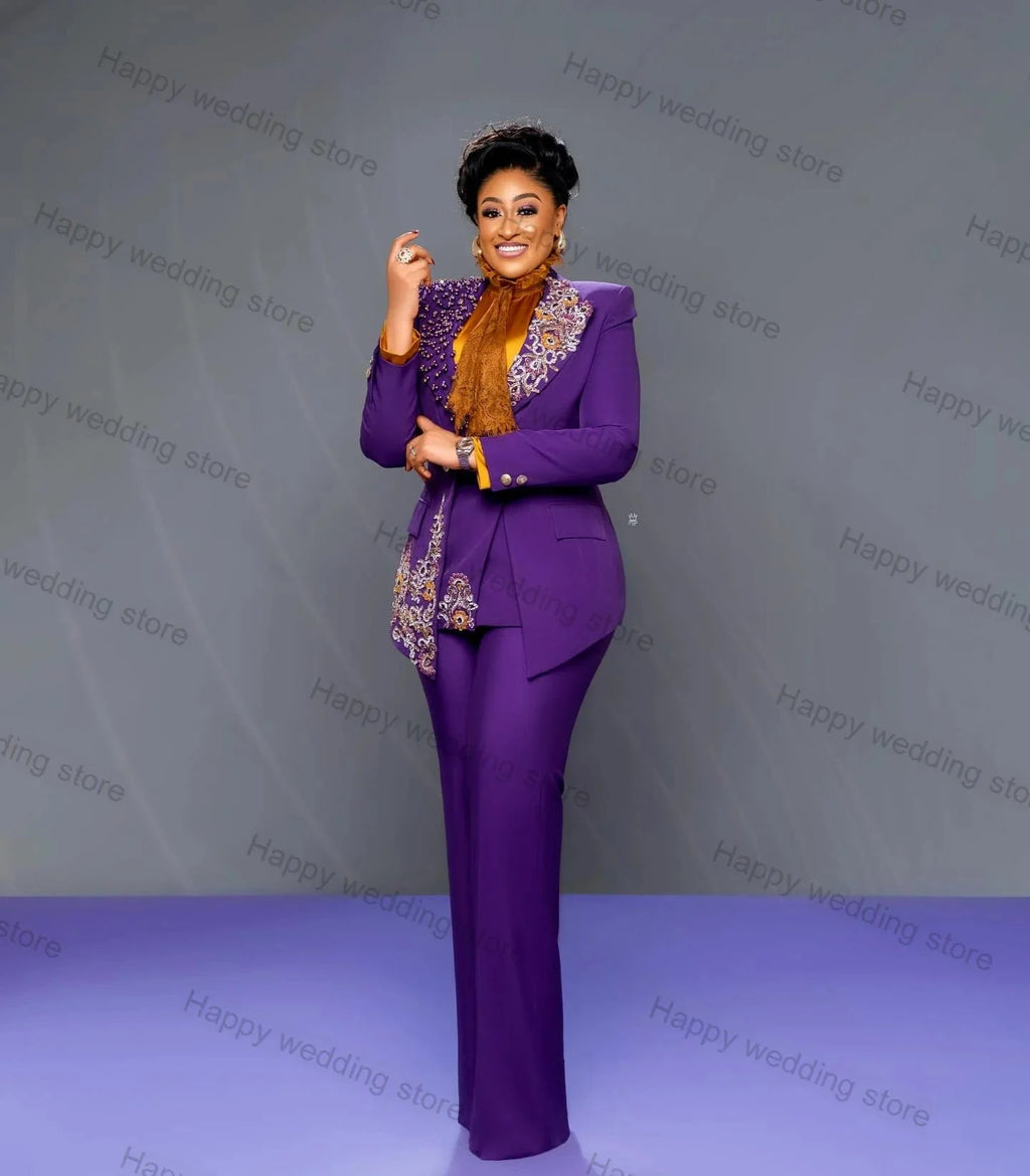 Purple women's 2-piece blazer suit with crystal embellishments, including tailored jacket and trousers, perfect for wedding or party attire.