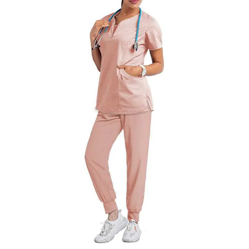 Pink women's medical scrub set with short sleeves, featuring top and pants, designed for nurses and healthcare professionals.