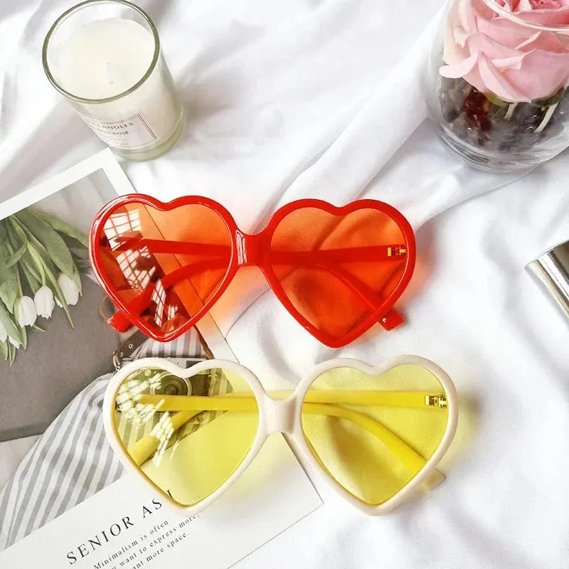 Retro heart-shaped sunglasses for women with colorful mirror lenses, UV400 protection, stylish red decorative frames, Showlu Fashion.