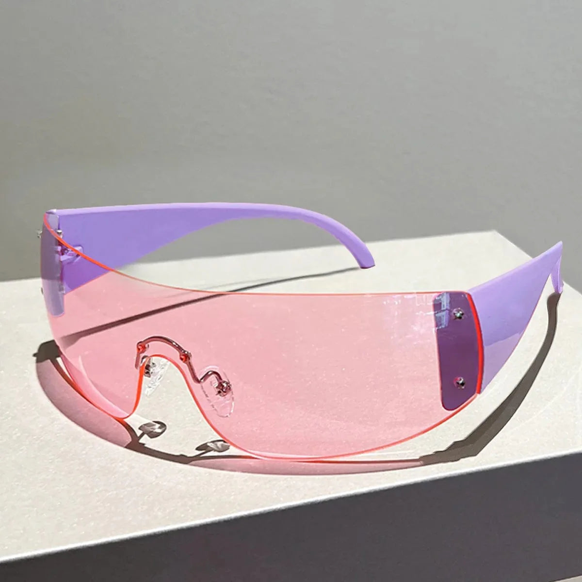 Buyuteen Y2K rimless sunglasses by Showlu Fashion in pink with steampunk design, UV400 protection, stylish unisex luxury shades.