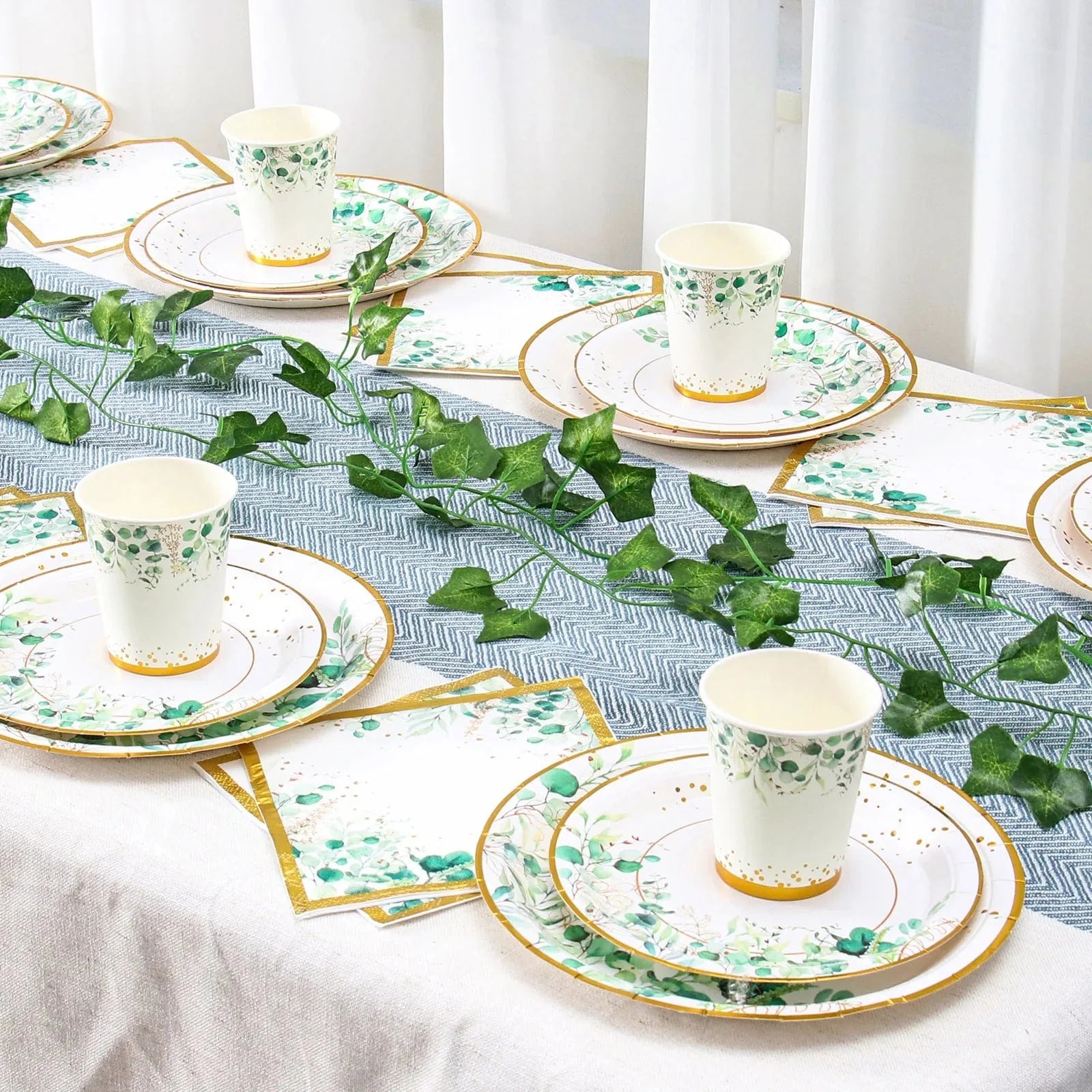 Sage green and gold disposable tableware set with paper plates, cups, and napkins, perfect for wedding or Hawaiian party decor