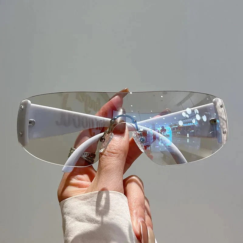 Buyuteen Y2K rimless sunglasses by Showlu Fashion with pink steampunk UV400 lenses, stylish luxury sun shades for women and men.