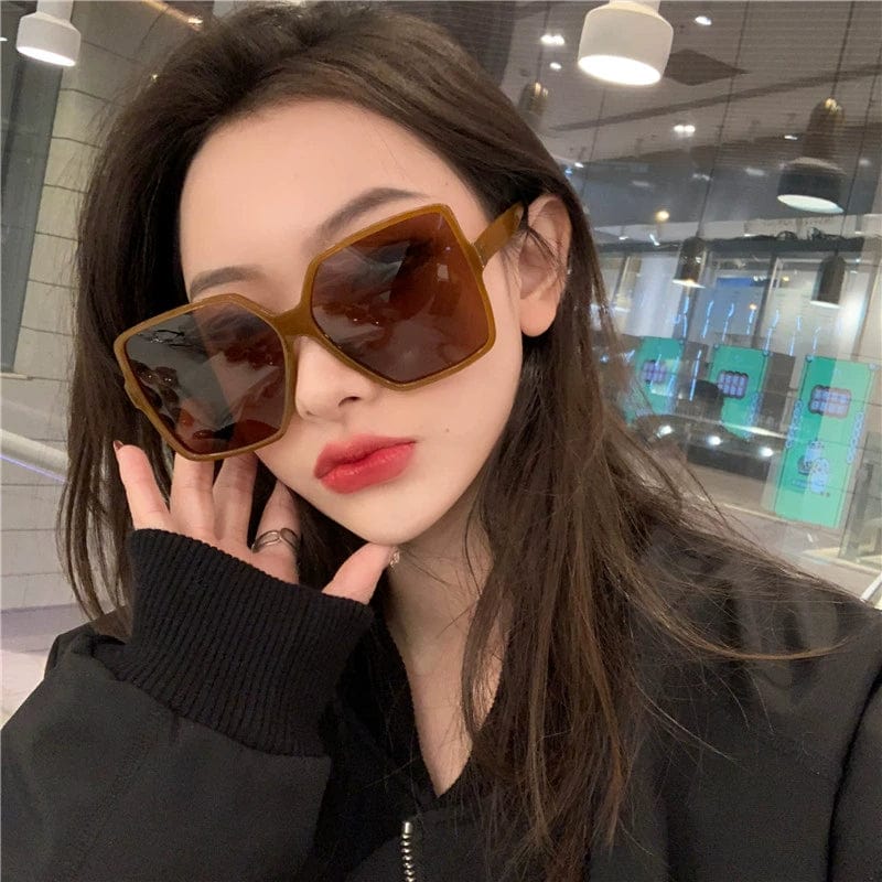 Showlu Women's Oversized Square Polarized Sunglasses with UV protection, stylish tea frame design and mirror lenses.