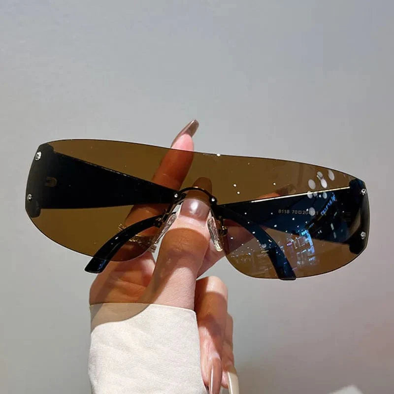 Buyuteen Y2K rimless sunglasses by Showlu Fashion, pink steampunk UV400 shades with rivet details, stylish unisex designer eyewear.