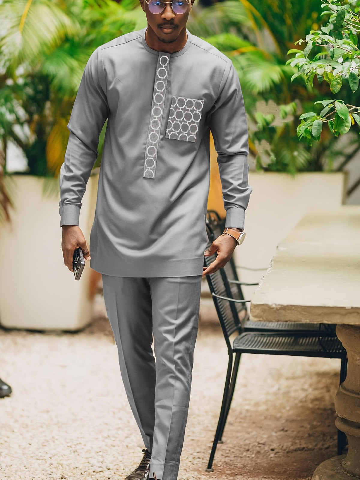 SHOWLU Men's African Dashiki set with embroidered long sleeve top and matching pants, traditional and stylish clothing.