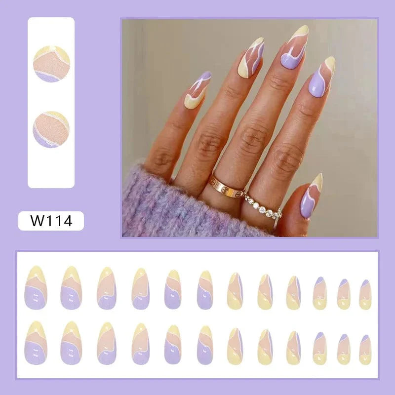 Purple floral almond press-on nails by Showlu Fashion Store, 24-piece acrylic tips with decorative floral design for a stylish manicure.