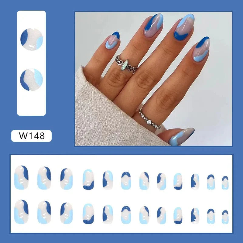 Showlu Purple Floral Almond Press-On Nails, 24-piece set with floral design, detachable acrylic tips for elegant manicures.