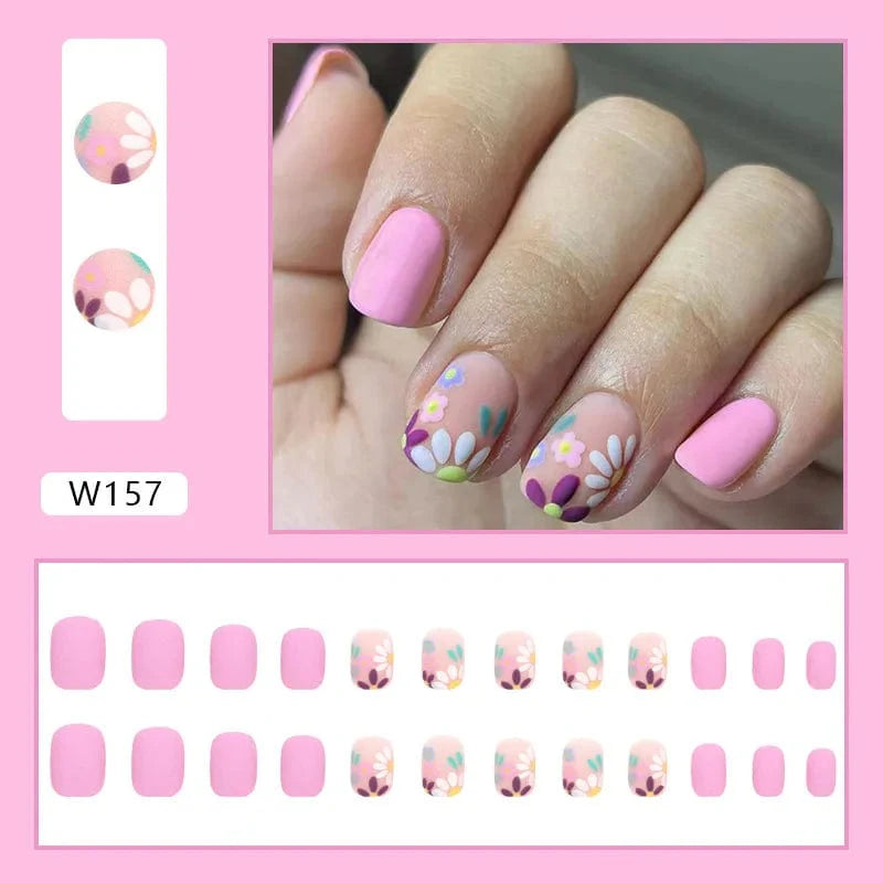 Purple floral almond-shaped press-on nails with decorative design, 24-piece set of detachable acrylic tips from Showlu Fashion Store.