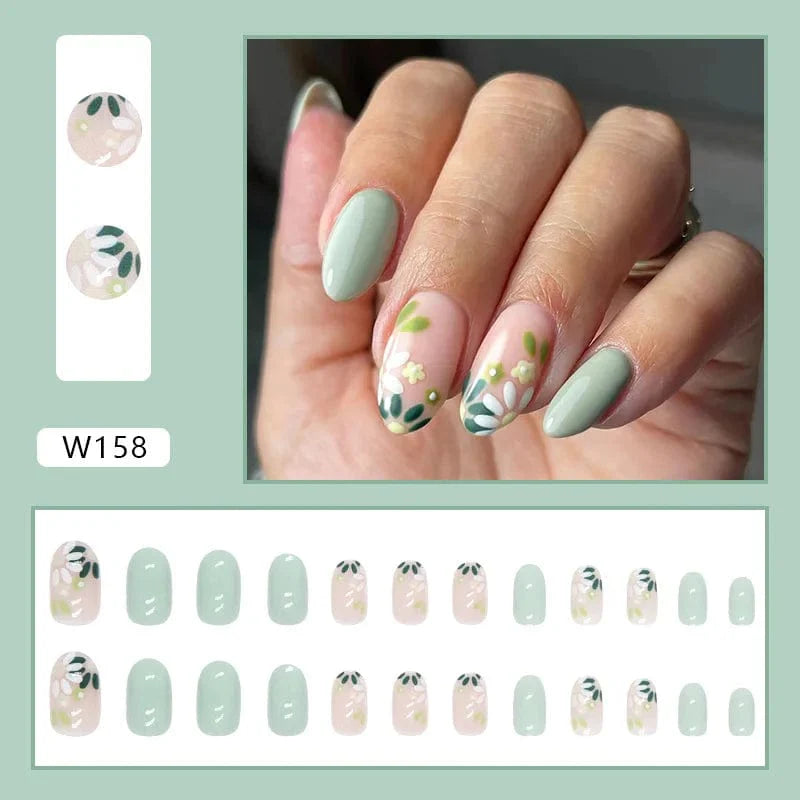 Purple floral almond press-on nails by Showlu Fashion Store, 24-piece acrylic tips with fresh floral design for elegant manicures.