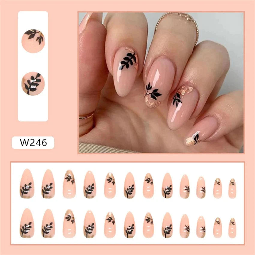 Showlu Purple Floral Almond Press-On Nails with 24-piece set, featuring detachable acrylic tips and floral design for elegant manicures.
