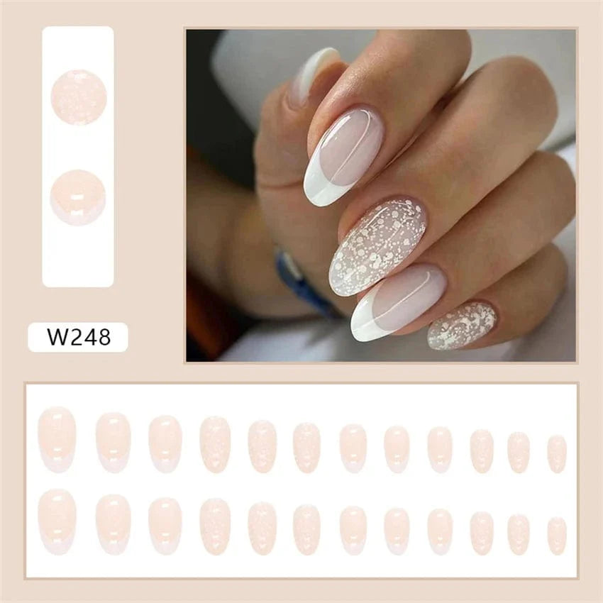 Showlu Purple Floral Almond Press-On Nails, 24-piece set with floral design, easy-to-apply acrylic tips for a stylish manicure.