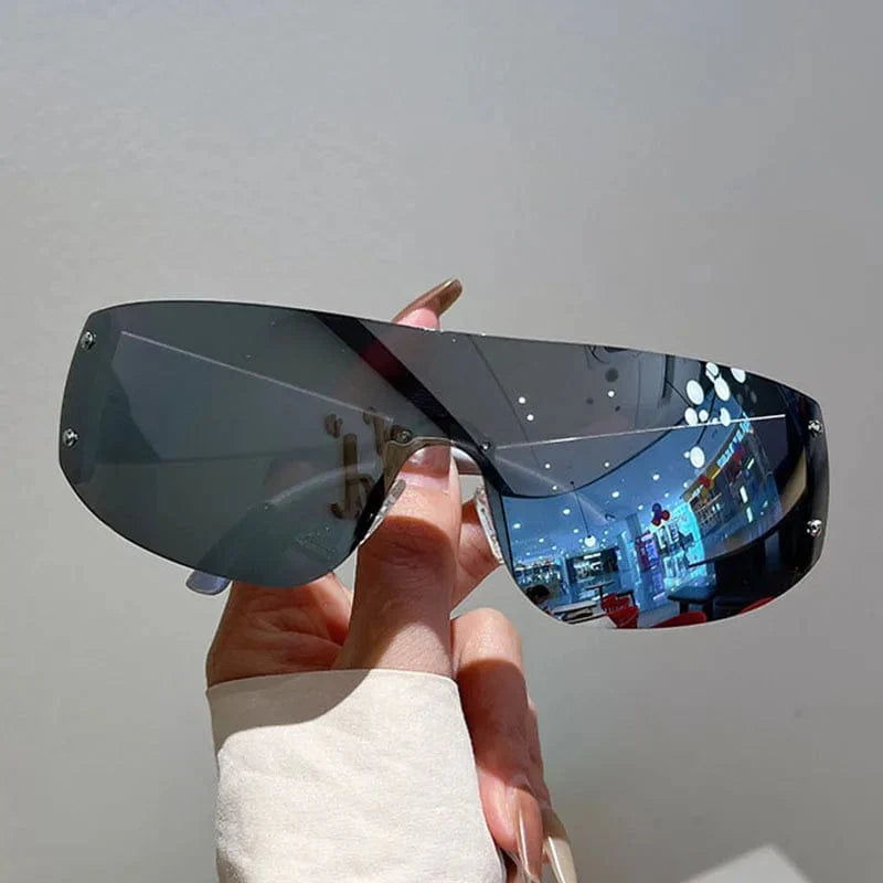 Buyuteen Y2K rimless sunglasses by Showlu Fashion, pink steampunk UV400 shades with rivet details, stylish unisex designer sunglasses.