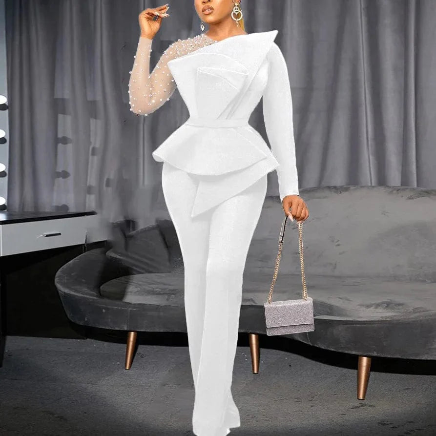 White beaded high-waisted women's jumpsuit with round neck, transparent sleeves, perfect for elegant parties and special occasions.