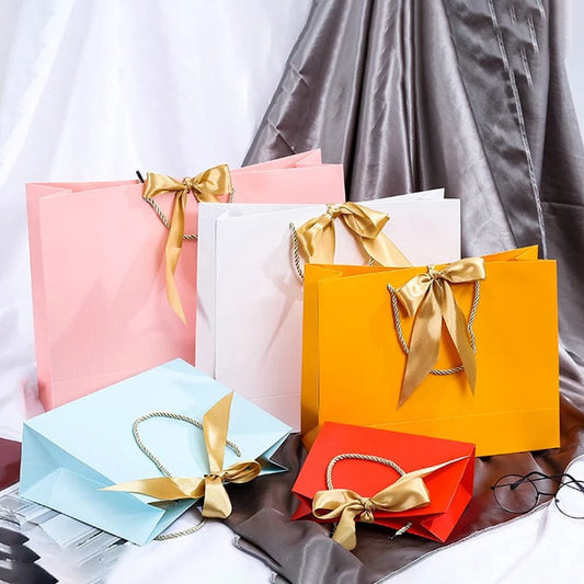 SHOWLU FASHION STORE Wholesale Paper Gift Bags with Ribbon Bow Recycled Wedding Shopping Bags with Handles Clothing Cosmetic Jewelry Packaging Bags