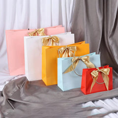 SHOWLU FASHION STORE Wholesale Paper Gift Bags with Ribbon Bow Recycled Wedding Shopping Bags with Handles Clothing Cosmetic Jewelry Packaging Bags