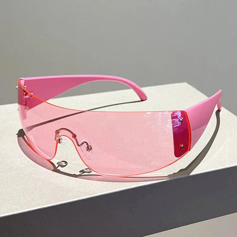 Buyuteen Y2K rimless sunglasses by Showlu Fashion, pink steampunk UV400 shades with rivet details, trendy unisex luxury eyewear.