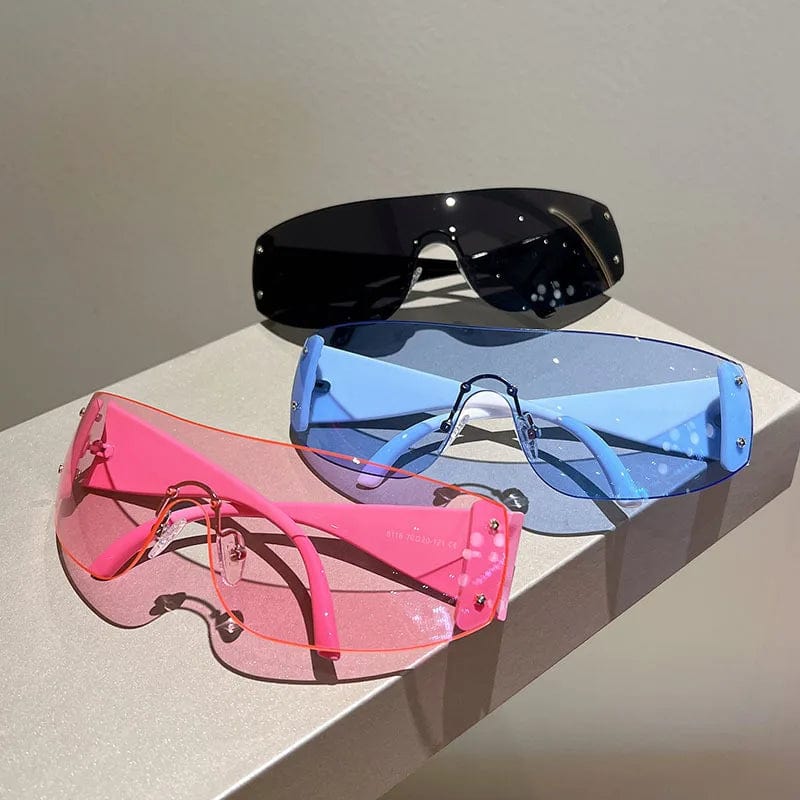 Buyuteen Y2K rimless sunglasses by Showlu Fashion, pink steampunk UV400 shades with rivet details for women and men.