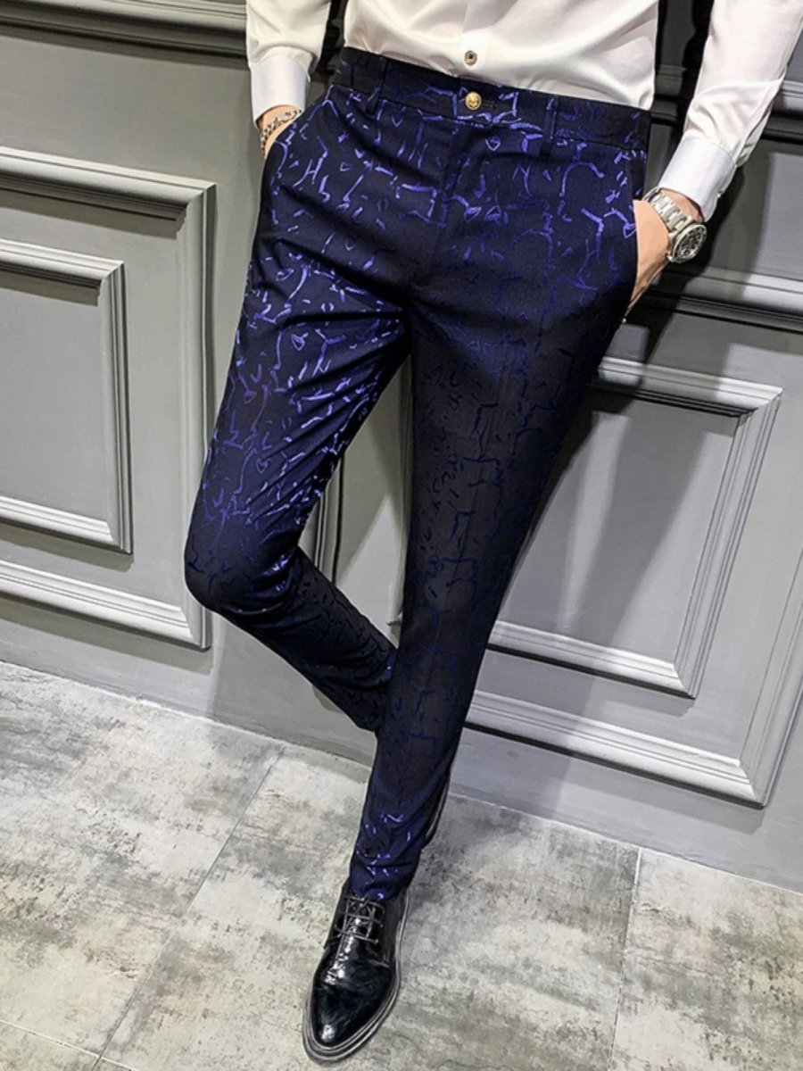 Slim fit floral leisure suit with one-button blazer worn by young man, stylish hair stylist in a nightclub setting.