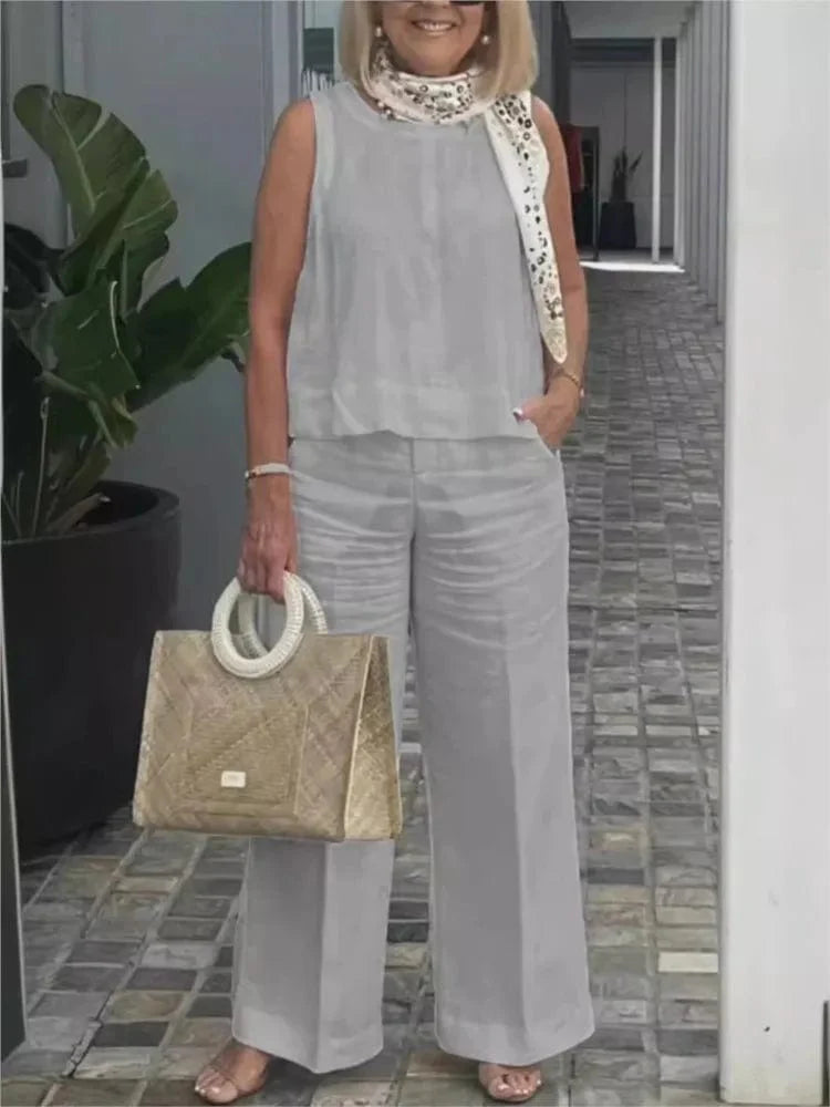 Women's cotton linen two-piece set with sleeveless blouse and wide-leg pants, casual summer fashion by Showlu Fashion Store.