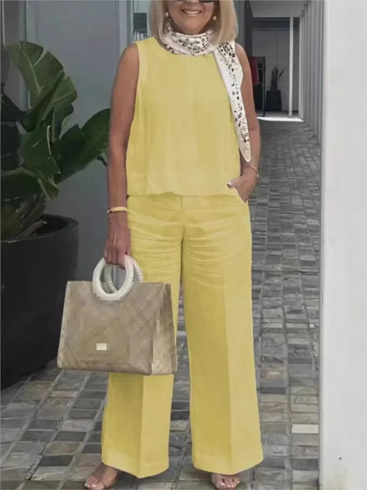 Loose sleeveless cotton linen two-piece set for women featuring a wide-leg pants and blouse, ideal for casual summer fashion.